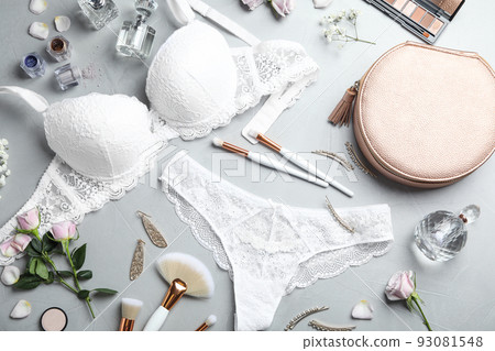 Flat lay composition with elegant women's underwear on light grey stone background 93081548