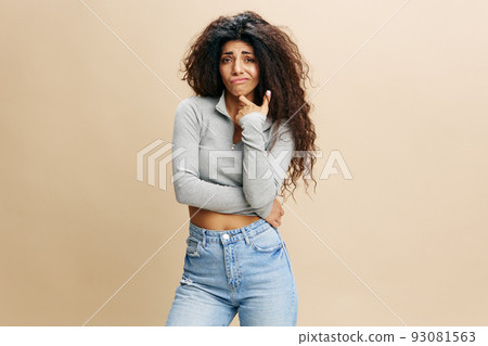 Portrait Of Pensive Latin Female Touching Chin And Looking To You With Doubt, Thoughtful Young Arab Woman Considering Interesting Offer While Standing Isolated Over Beige Background, Copy Space Portrait Of Pensive Latin Female Touching Chin And Looking To You With Doubt, Thoughtful Young Arab Woman Considering Interesting Offer While Standing Isolated Over Beige Background, Copy Space 93081563
