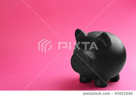 Black piggy bank on pink background. Space for text Black piggy bank on pink background. Space for text 93081680