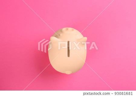 Beige piggy bank on pink background, top view Beige piggy bank on pink background, top view 93081681