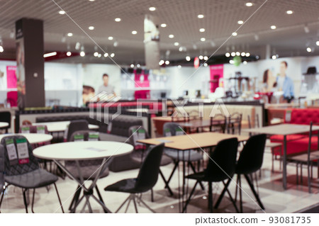 Blurred view of furniture store in mall. Bokeh effect Blurred view of furniture store in mall. Bokeh effect 93081735