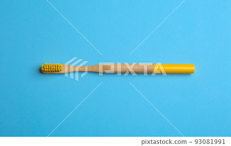Toothbrush made of bamboo on light blue background, top view Toothbrush made of bamboo on light blue background, top view 93081991