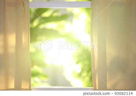 Beautiful view through window on garden in morning Beautiful view through window on garden in morning 93082114