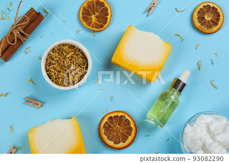 Flat lay composition with natural handmade soap and ingredients on light blue background 93082290