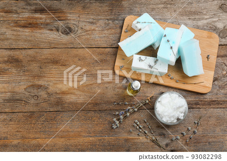 Flat lay composition with natural handmade soap and ingredients on wooden table, space for text Flat lay composition with natural handmade soap and ingredients on wooden table, space for text 93082298