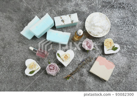 Flat lay composition with natural handmade soap and ingredients on grey stone table Flat lay composition with natural handmade soap and ingredients on grey stone table 93082300