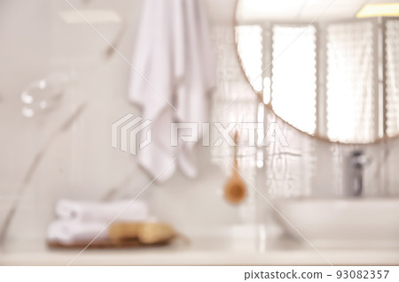 Blurred view of stylish modern bathroom with mirror Blurred view of stylish modern bathroom with mirror 93082357