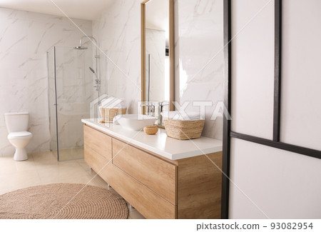 Large mirror and vessel sink in bathroom 93082954