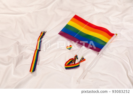 LGBT attributes on a white background of a crumpled sheet LGBT attributes on a white background of a crumpled sheet 93083252