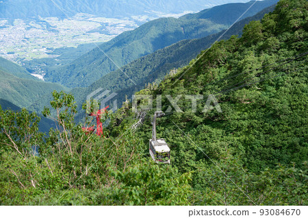 Komagane City and Komagatake Ropeway seen from Senjojiki Cirque in summer Komagane City and Komagatake Ropeway seen from Senjojiki Cirque in summer 93084670