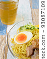 Chilled Chinese noodles _ Vertical photo _ Three-part composition _ Colorful wood grain background _ Tea accessories 93087109
