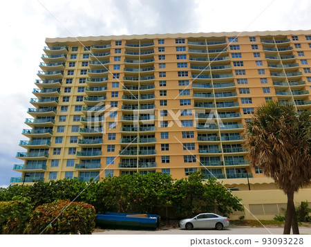 Modern apartment buildings with palm trees at Miami - view from road Modern apartment buildings with palm trees at Miami - view from road 93093228