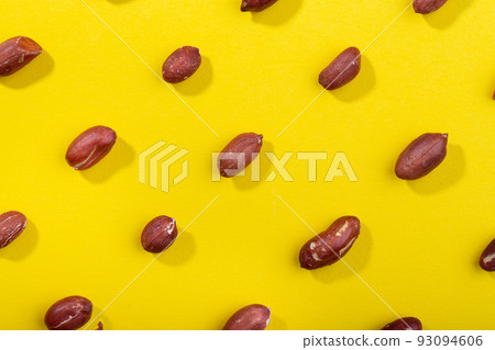 Pattern of peanuts. Fashionable sunny pattern of peanuts  on yellow background. 93094606