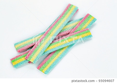 Licorice Candy. Sweet gummy sticks with different flavor, on white background. Top view. 93094607