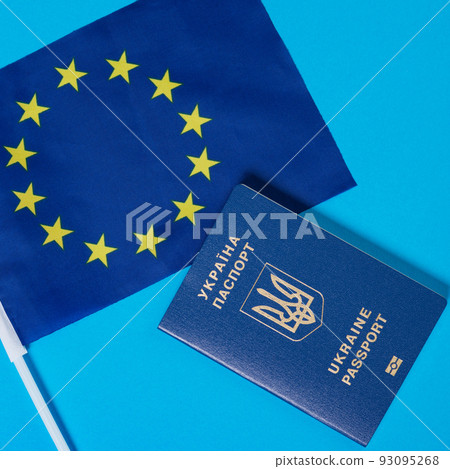 eu flag and ukraine passport, european union accession concept eu flag and ukraine passport, european union accession concept 93095268