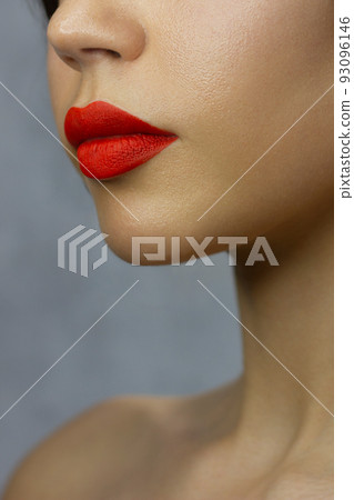 Closeup plump Lips. Lip Care, Augmentation, Fillers. Macro photo with Face detail. Natural shape with perfect contour. Close-up perfect lip makeup beautiful female mouth. Plump sexy full red lips 93096146