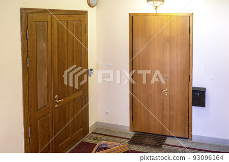 Beautiful spacious entrance in a residential building with stairs and an elevator Beautiful spacious entrance in a residential building with stairs and an elevator 93096164