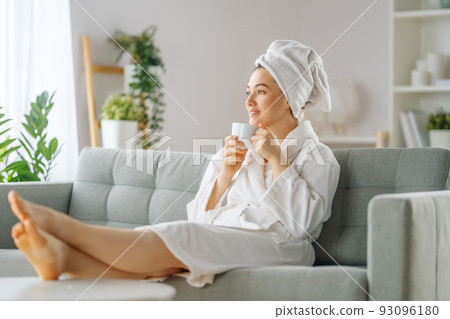 woman is relaxing after a bath woman is relaxing after a bath 93096180