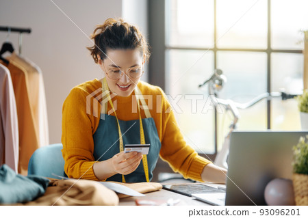 Woman is working at workshop Woman is working at workshop 93096201
