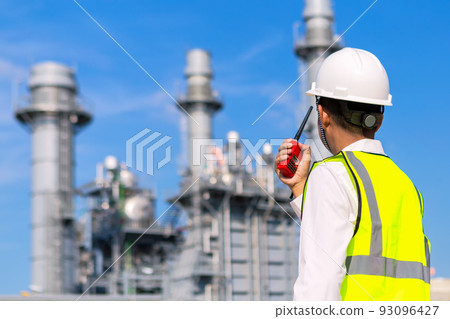 Engineer is checking around gas turbine electric power plant Engineer is checking around gas turbine electric power plant 93096427