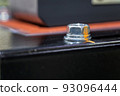 close-up view of base robot with bolts of a heavy metal and point mark 93096444