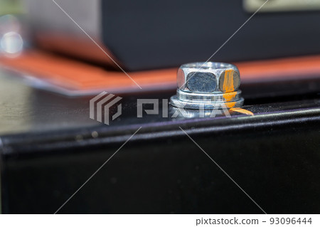 close-up view of base robot with bolts of a heavy metal and point mark close-up view of base robot with bolts of a heavy metal and point mark 93096444