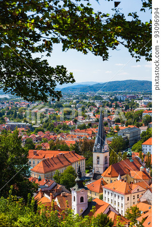 Slovenia Ljubljana Old Town cityscape and St. James Church seen from Ljubljana Castle Hill Slovenia Ljubljana Old Town cityscape and St. James Church seen from Ljubljana Castle Hill 93096994