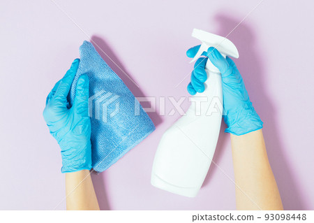 Close-up female hands wearing cleaning gloves Close-up female hands wearing cleaning gloves 93098448