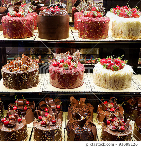 Assorted fancy cakes in a shop-window 93099120