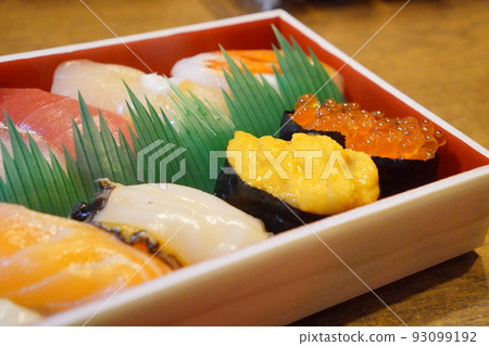 Nigiri sushi brought back by takeout 93099192