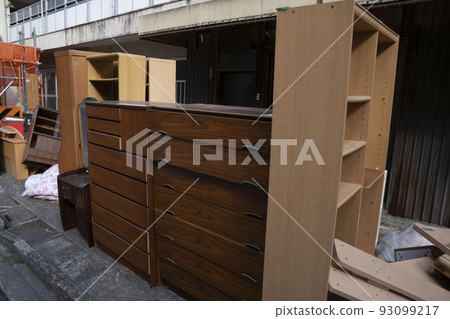 Oversized garbage on furniture, garbage storage during the moving season, piled up bulky garbage, unwanted furniture, 93099217