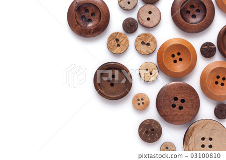 Button isolated on white  background. Wooden buttons collection closeup 93100810