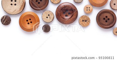 Button isolated on white  background. Wooden buttons collection closeup 93100811