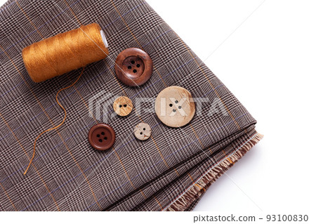 Tailor or sewing accessories and supplies on white  background. Creative concept with folded fabric 93100830