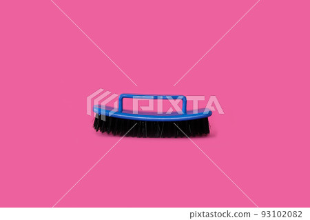 Brush for clothes on a bright pink background 93102082