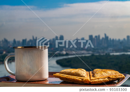 Breakfast - sandwiches and coffee on a wooden tray. Breakfast - sandwiches and coffee on a wooden tray. 93103300