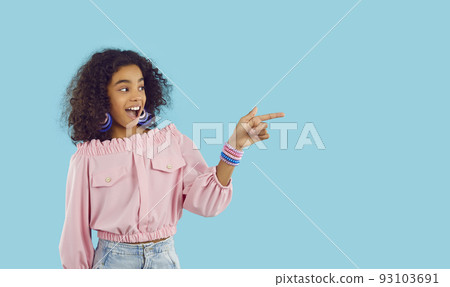 Happy biracial teenager point at copy space aside 93103691