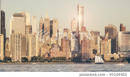 Manhattan waterfront at sunset, retro color toning applied, New York City, USA. Manhattan waterfront at sunset, retro color toning applied, New York City, USA. 93104402