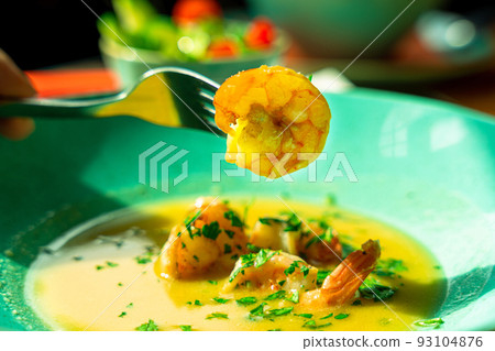 Seafood soup shrimp dish. Thai spicy prawn soup in plate. Thai shrimp curry food with creamy coconut milk. 93104876