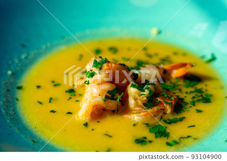 Shrimp soup seafood dish. Thai spicy prawn soup in plate. Thai shrimp curry food with creamy coconut milk. Shrimp soup seafood dish. Thai spicy prawn soup in plate. Thai shrimp curry food with creamy coconut milk. 93104900