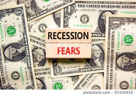 Recession fears symbol. Concept words Recession fears on wooden blocks on a beautiful background from dollar bills. Business and recession fears concept. Copy space. Recession fears symbol. Concept words Recession fears on wooden blocks on a beautiful background from dollar bills. Business and recession fears concept. Copy space. 93104938