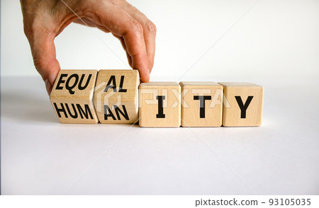 Equality and humanity symbol. Businessman turns wooden cubes and changes the word 'equality' to 'diversity'. Beautiful white background. Business, equality and humanity concept. Copy space. Equality and humanity symbol. Businessman turns wooden cubes and changes the word 'equality' to 'diversity'. Beautiful white background. Business, equality and humanity concept. Copy space. 93105035