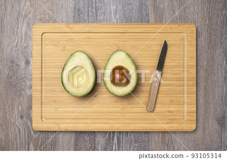 ripe haas avocados on cutting board ripe haas avocados on cutting board 93105314