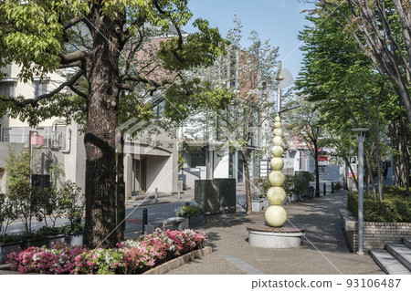 In front of the north exit of Daikanyama Station, the pavement with sunlight filtering through the trees leading to the entrance of Daikanyama Station, Daikanyama, Shibuya Ward 93106487