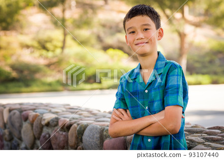 Outdoor portrait of a mixed race Chinese and Caucasian boy. Outdoor portrait of a mixed race Chinese and Caucasian boy. 93107440