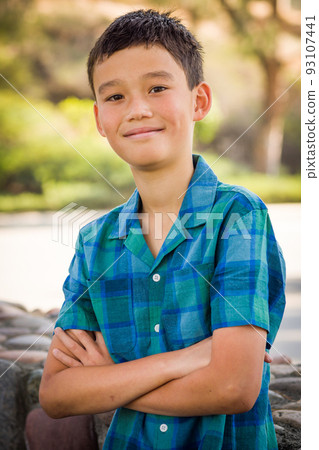 Outdoor portrait of a mixed race Chinese and Caucasian boy. Outdoor portrait of a mixed race Chinese and Caucasian boy. 93107441