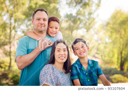 Outdoor portrait of mixed race Chinese and Caucasian family. Outdoor portrait of mixed race Chinese and Caucasian family. 93107604