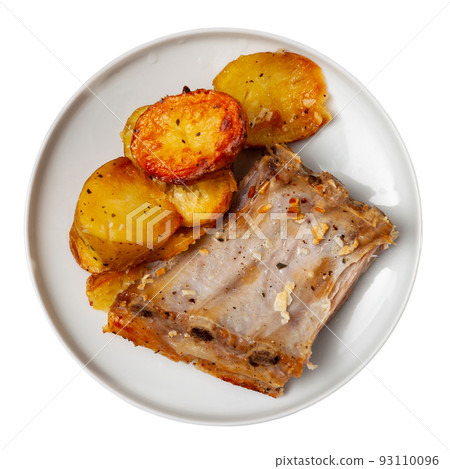 Pork ribs with boiled potatoes and spices on ceramic plate Pork ribs with boiled potatoes and spices on ceramic plate 93110096
