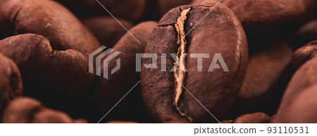 Coffee lover view of roasted coffee beans for background and texture. Dumped roasted coffee beans can be used as background and texture. Photo banner. roasted coffee Coffee lover view of roasted coffee beans for background and texture. Dumped roasted coffee beans can be used as background and texture. Photo banner. roasted coffee 93110531