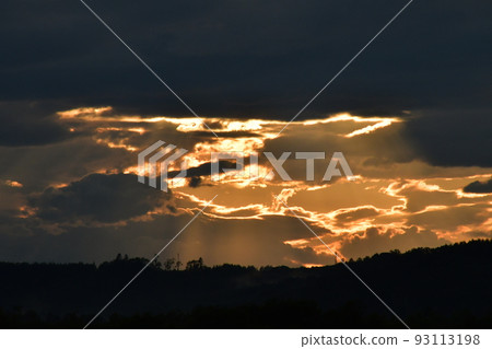 sunset through the clouds sunset through the clouds 93113198